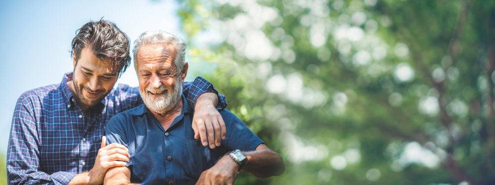 Son and father spending time together after realizing there is a need for Alzheimers care