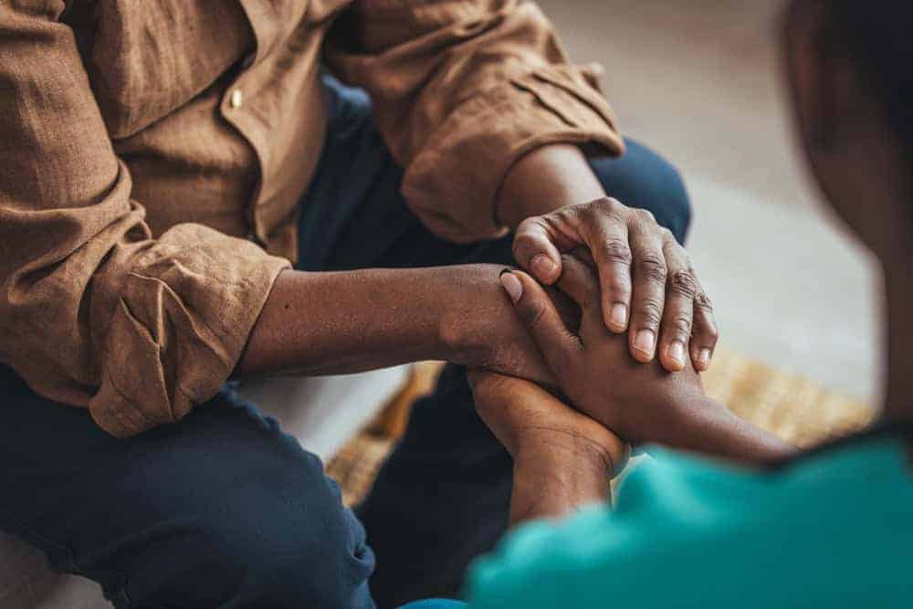 Holding your loved one's hands once you realize they are struggling while communicating | caring for alzheimers patients