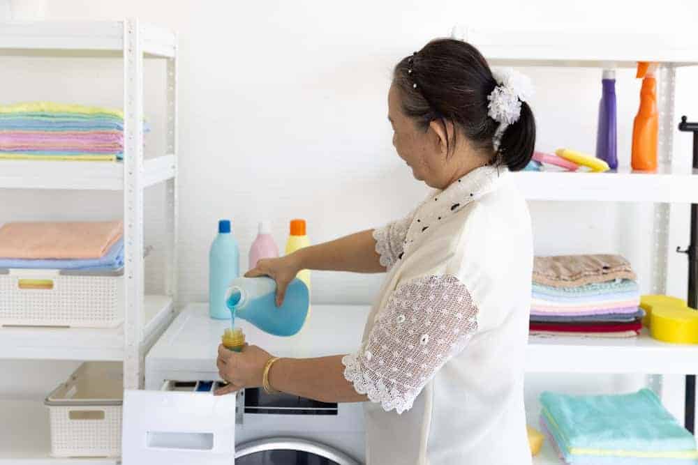 24 hour home health aide doing the laundry at a senior’s home