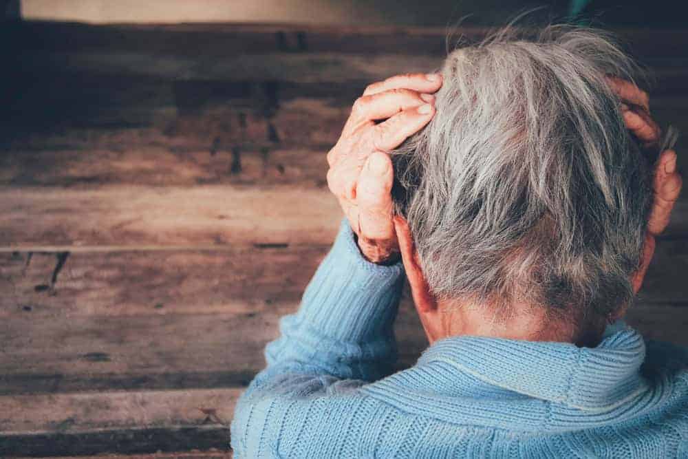 a senior woman isolated and sad at home