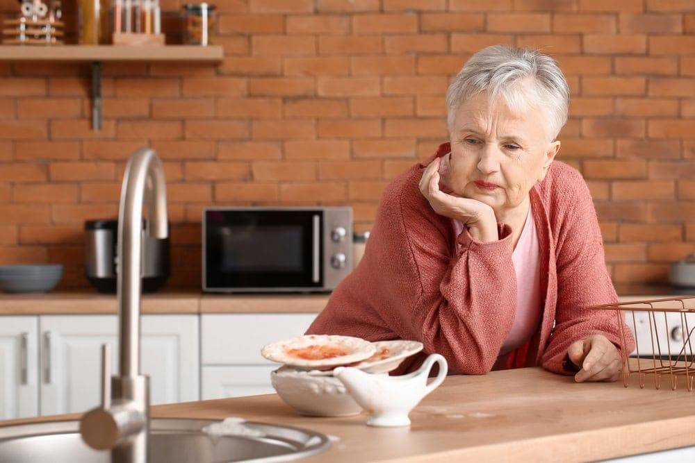 senior woman in untidy kitchen - home health aide services