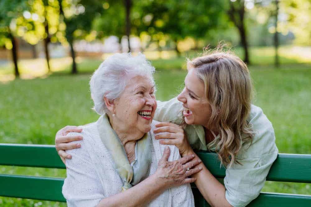 A happy senior spending time with her live-in care provider