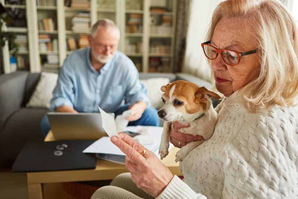 a senior couple going through their financials when considering residential care homes