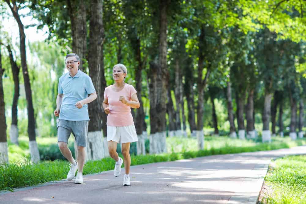 A senior couple taking their morning jog happily | home health care examples.