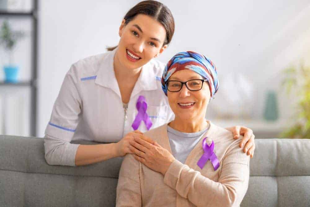 A senior woman with cancer consulting her doctor