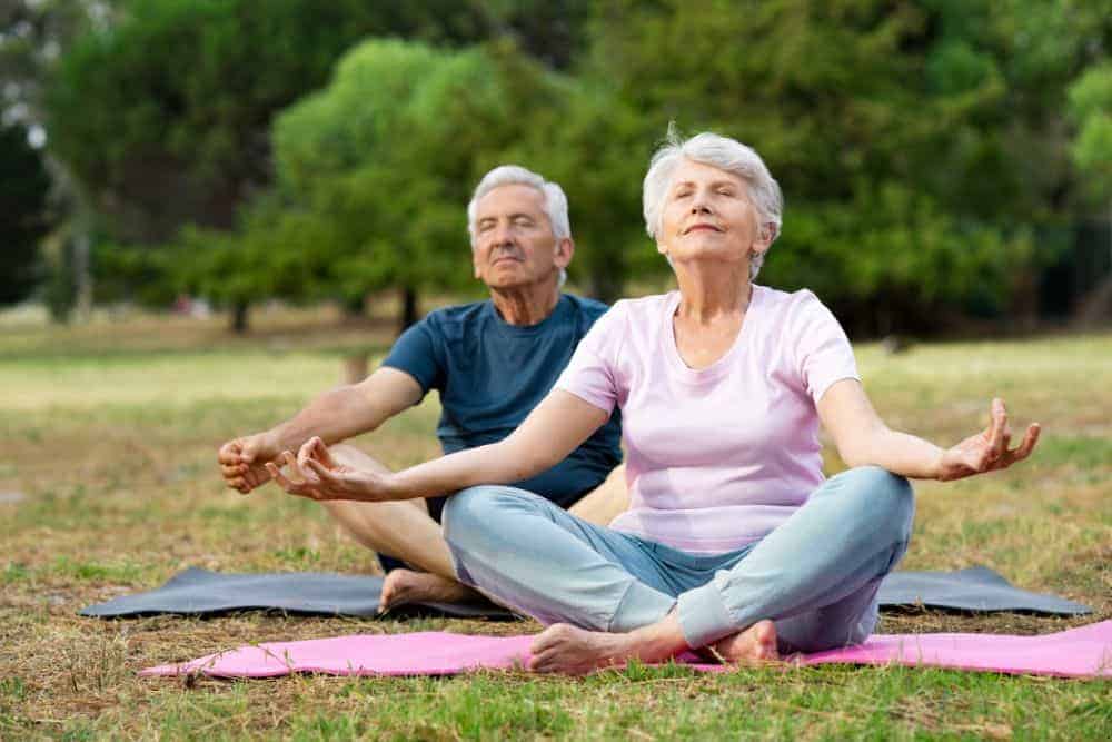 A senior couple doing yoga