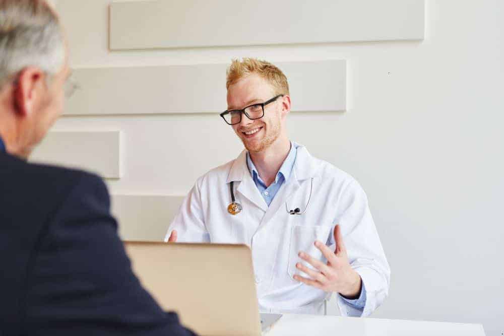 elderly consulting with a doctor