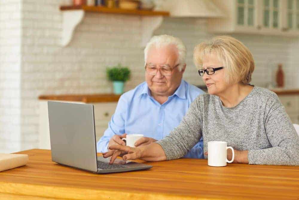 an elderly man maintaining connection with his family through Facetime