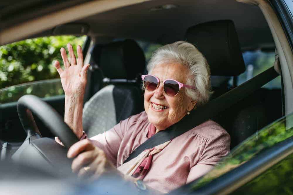 Senior woman driving alone - promoting elderly independence