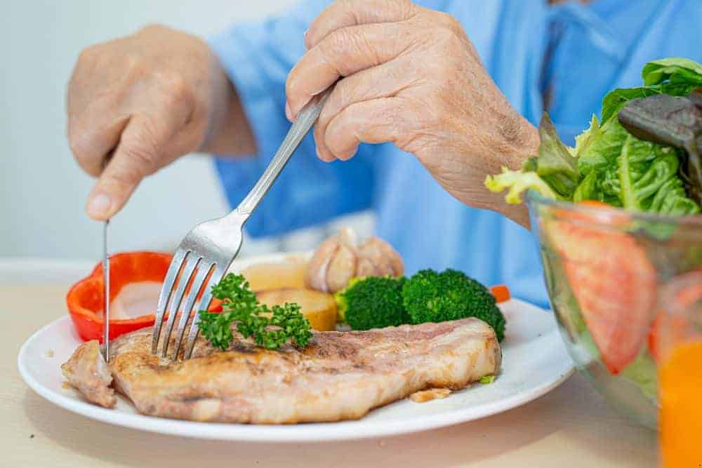 healthy personalized meal in a plate for the elderly