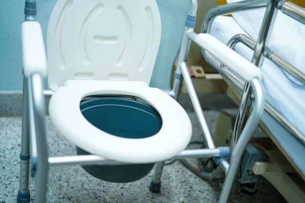 a senior woman falling on the floor of the bathroom