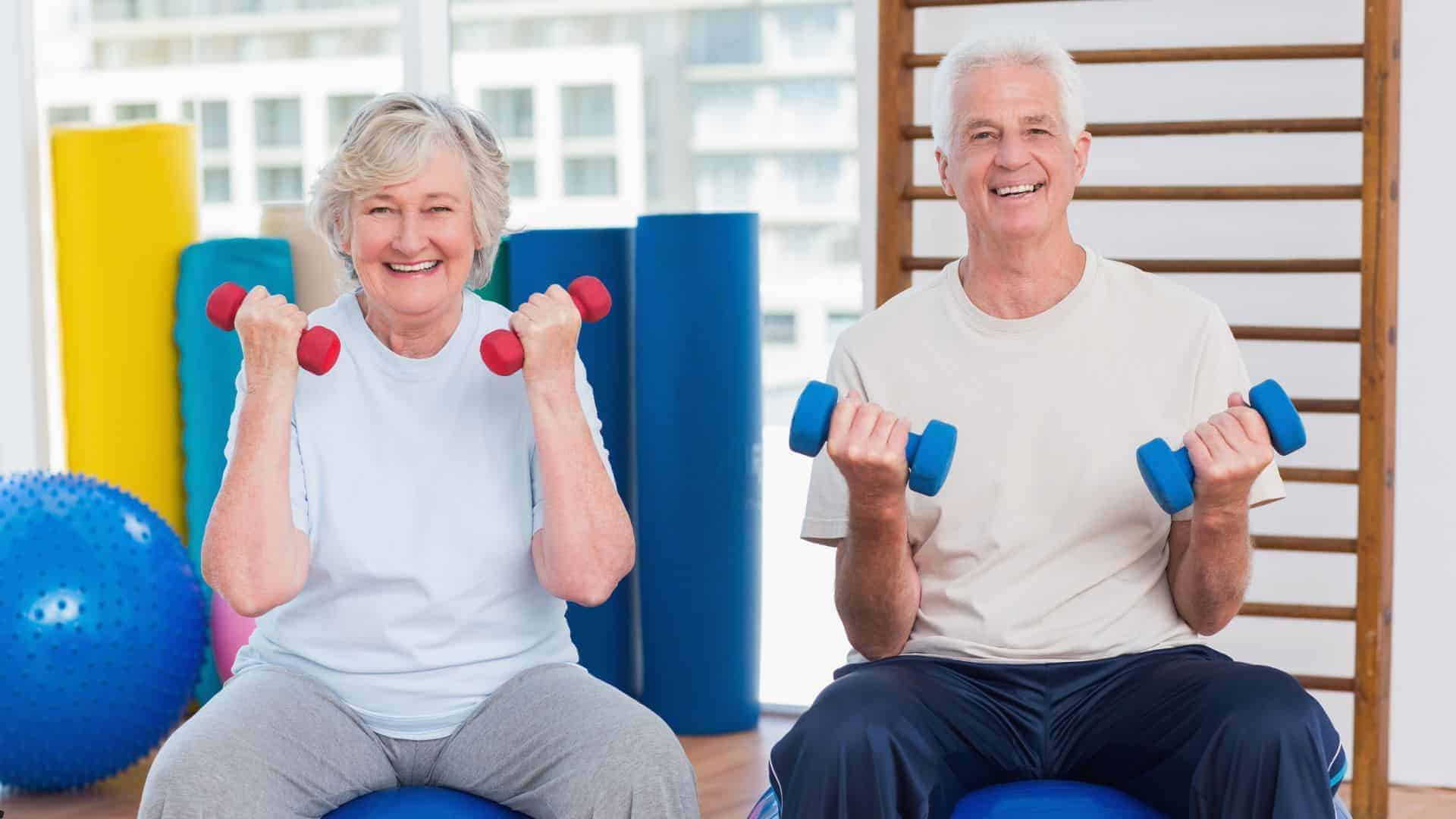 two seniors doing light weight lifting - safe physical activity