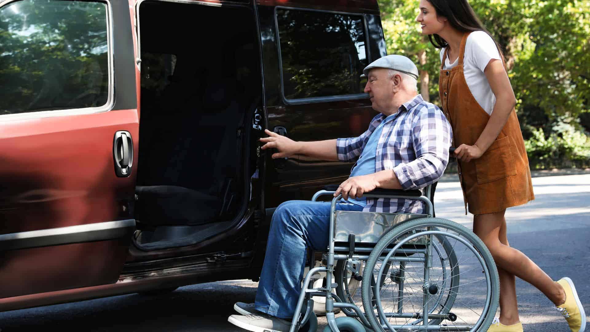 older man receiving help with transportation