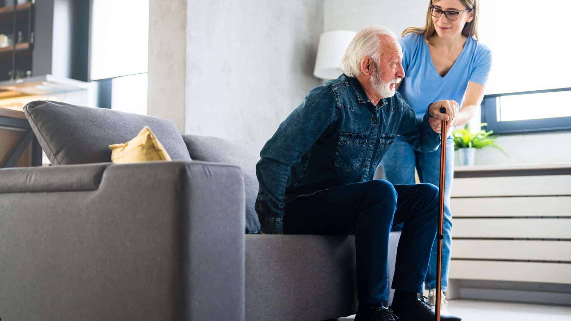 senor woman being helped by a caregiver aid