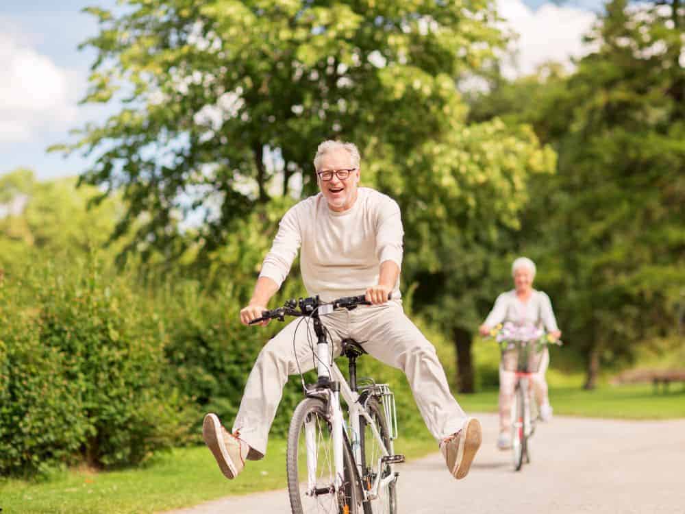 A senior couple enjoying biking - types of senior care