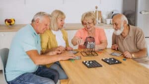 A group of happy seniors enjoying social engagement activities in a Reno assisted living facility.