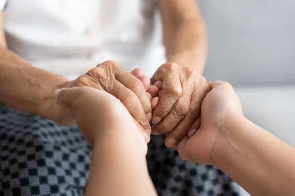 An adult child and their parent in Reno finding comfort and support while navigating senior care decisions.