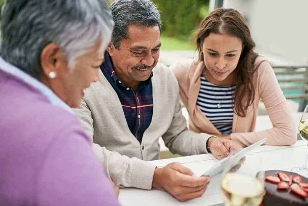 A family having a detailed discussion with a senior care advisor.
