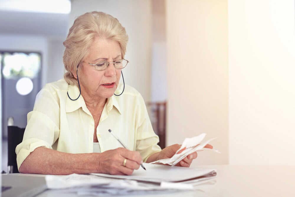 A senior carefully planning for assisted living payment options in Nevada.