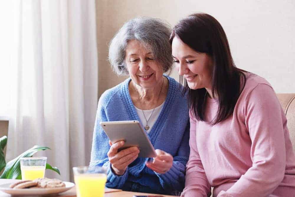A caregiver providing one-on-one attention to a senior resident in Reno.