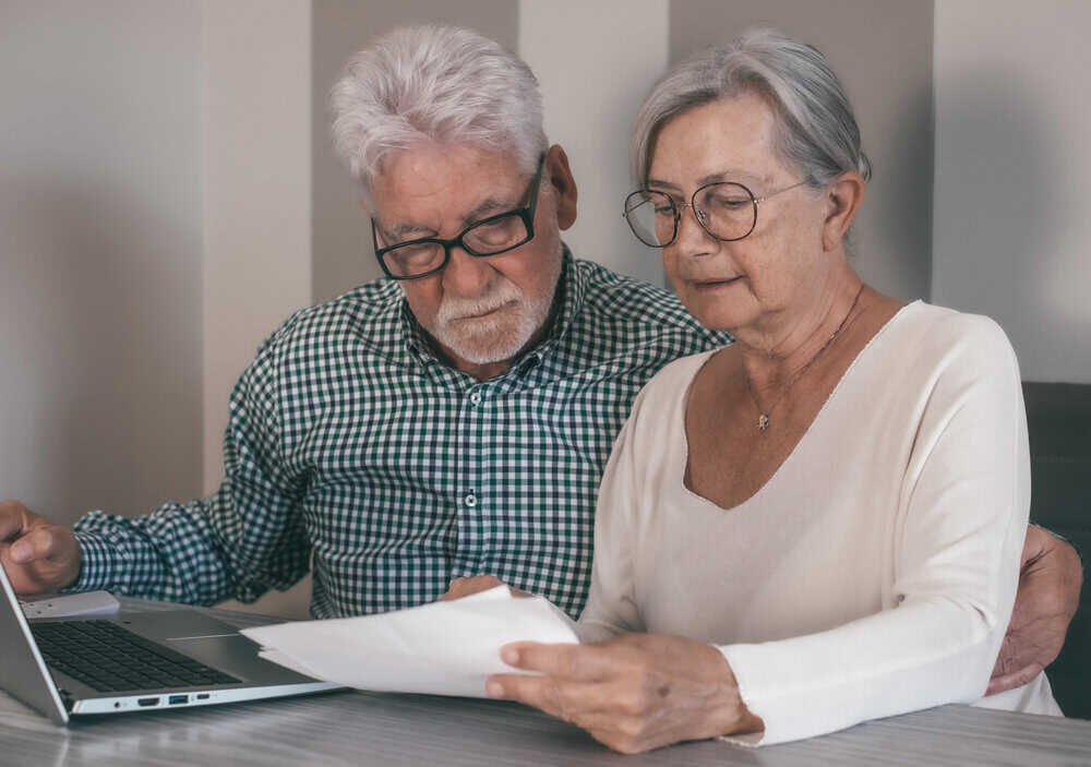 Couple reviewing their long-term care insurance policy to pay for assisted living in Nevada.