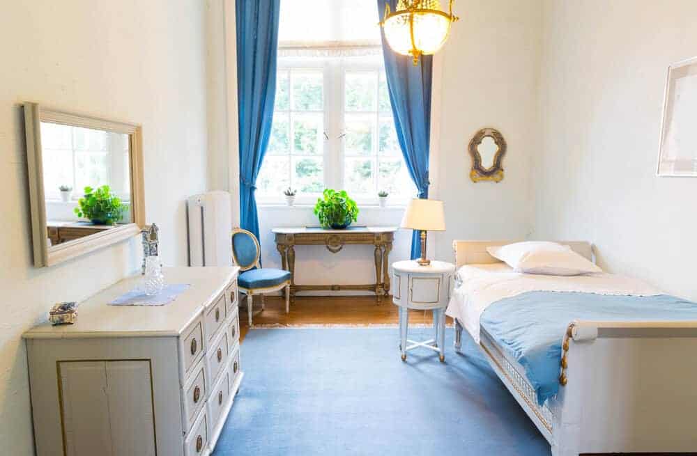 Interior of a tidy and personalized resident room in a senior care home Interior of a tidy and personalized resident room in a senior care home