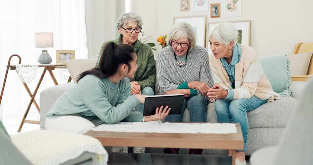 A family discussing personalized care options in a home-like assisted living setting.