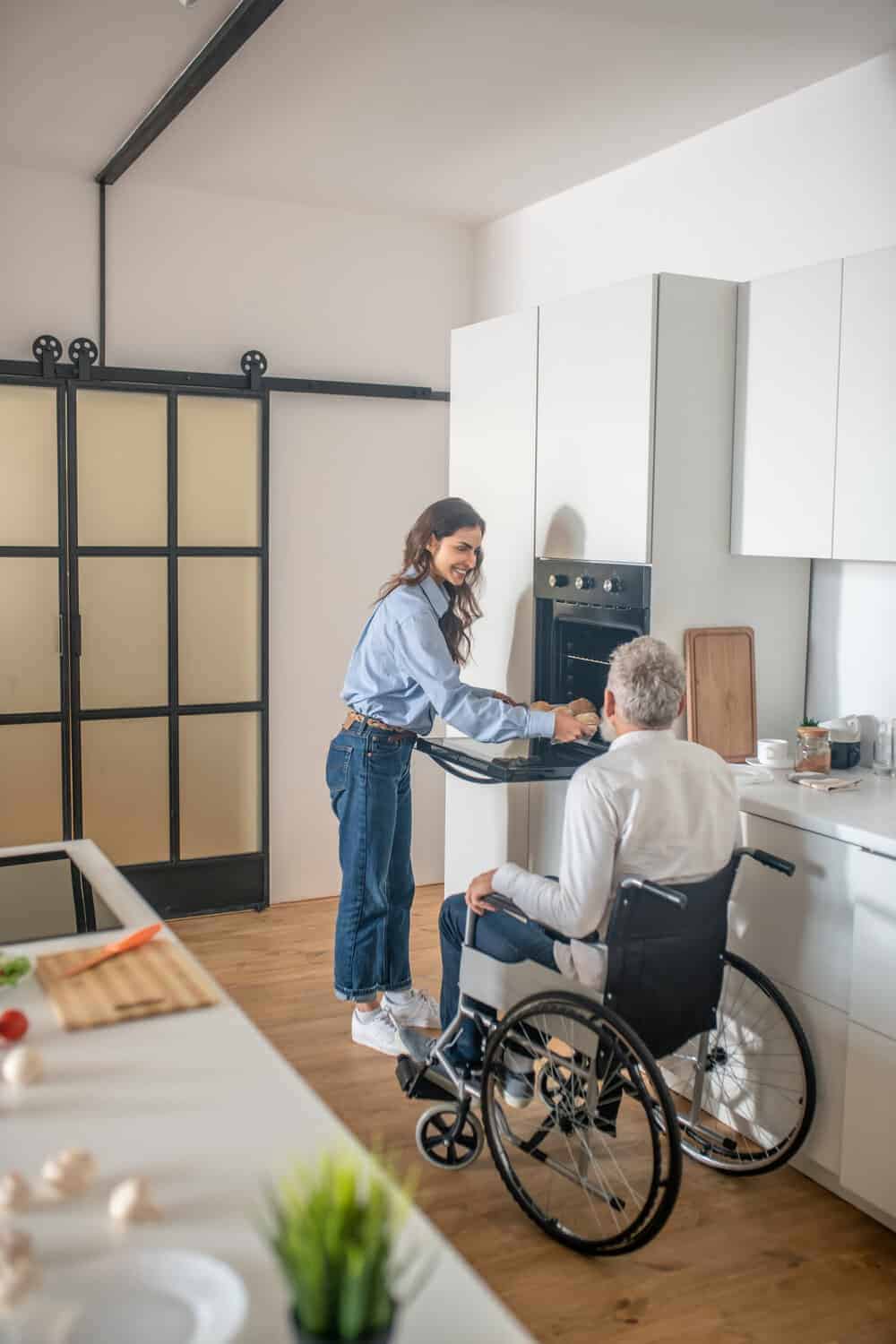 In-home caregiver assisting a senior man in his Reno home