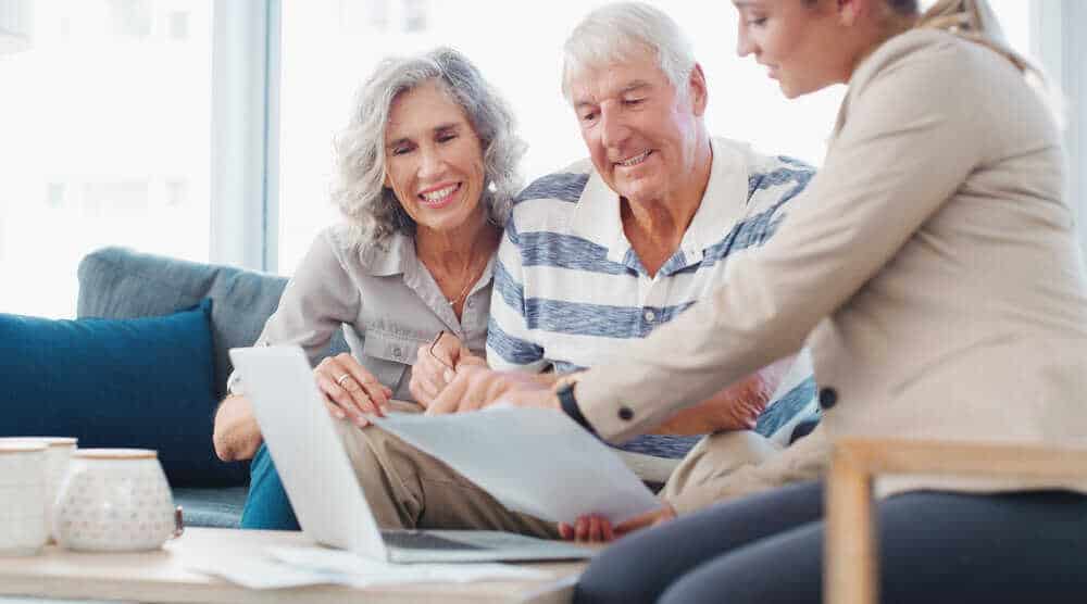 A family in Carson City reviewing the financial details of senior living options.