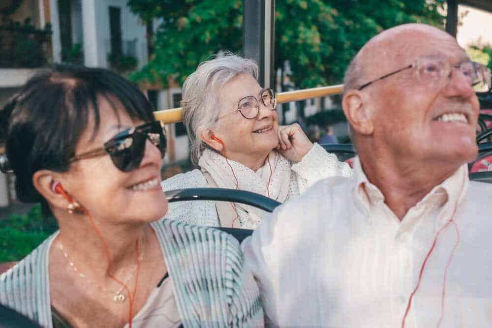 A group of happy seniors on a Washoe County senior shuttle bus